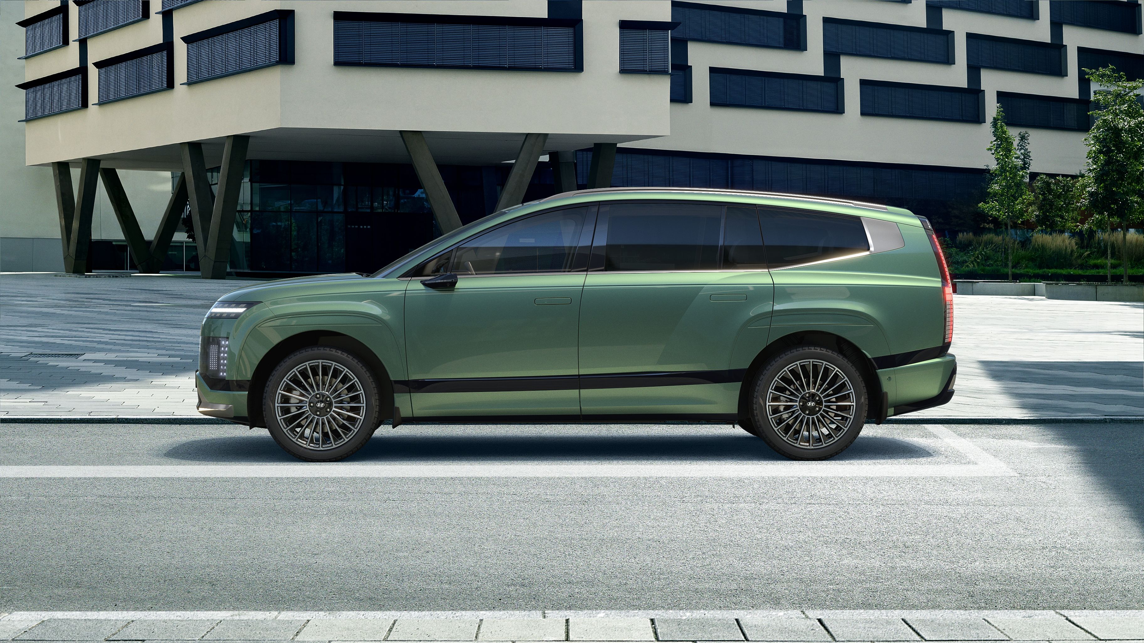 Side view of green Hyundai IONIQ 9 electric SUV.